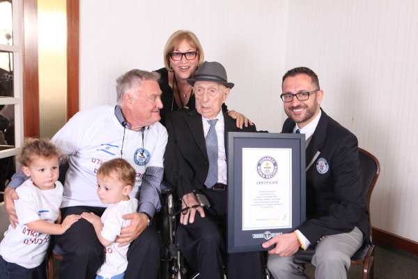 Marco Frigatti, Head of Records for Guinness World Records, presents Israel Kristal his certificate of achievement for Oldest living man on 11th March 2016, Haifa, Israel. Copyright: ©GUINNESS WORLD RECORDS - From L-R: grandchildren Nevo and Omer, Heim Kristal (son), Shula Kuperstoch (daughter), Israel Kristal, Marco Frigatti